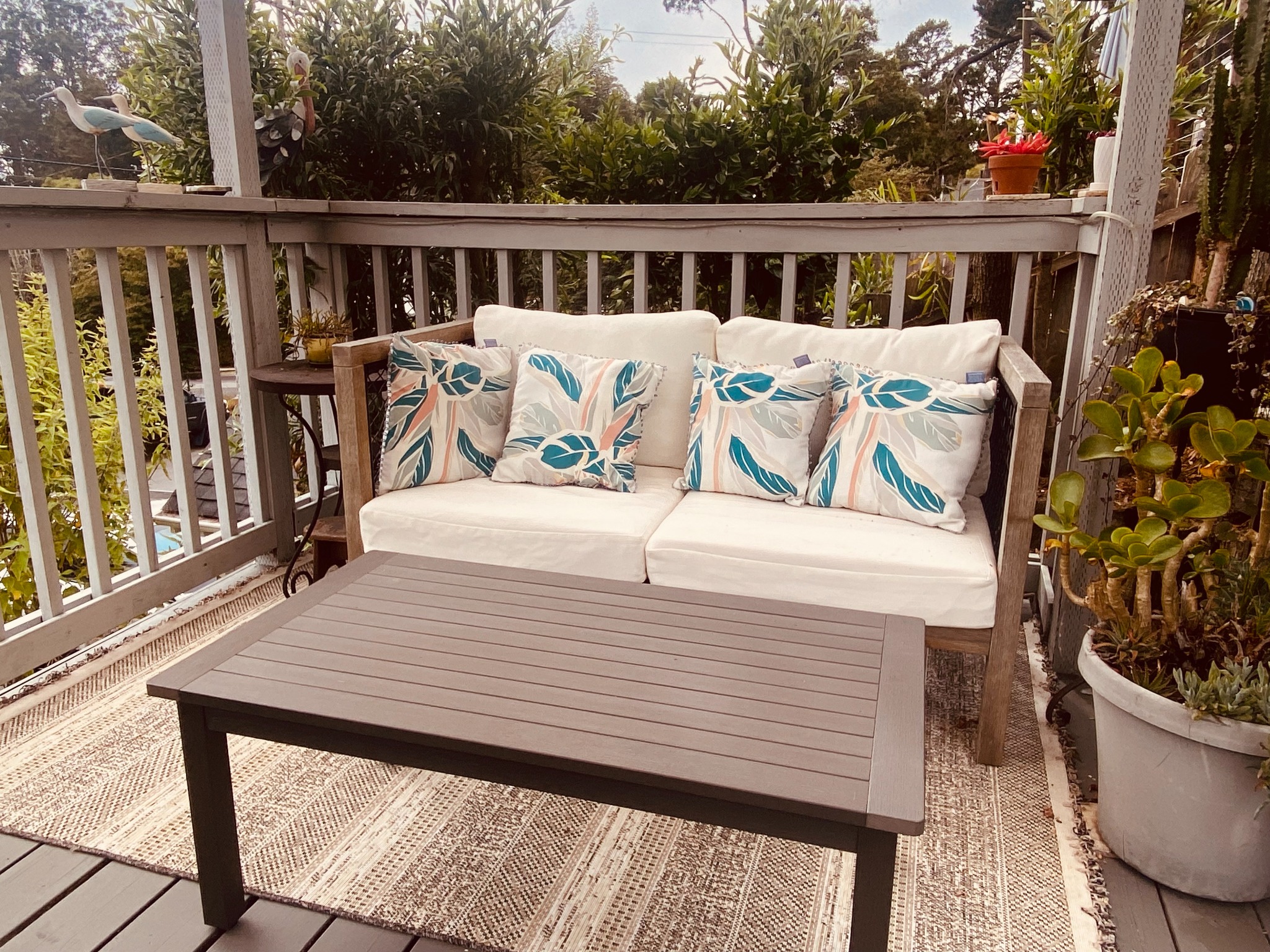 Cushioned garden lounge at Ocean Garden Retreats